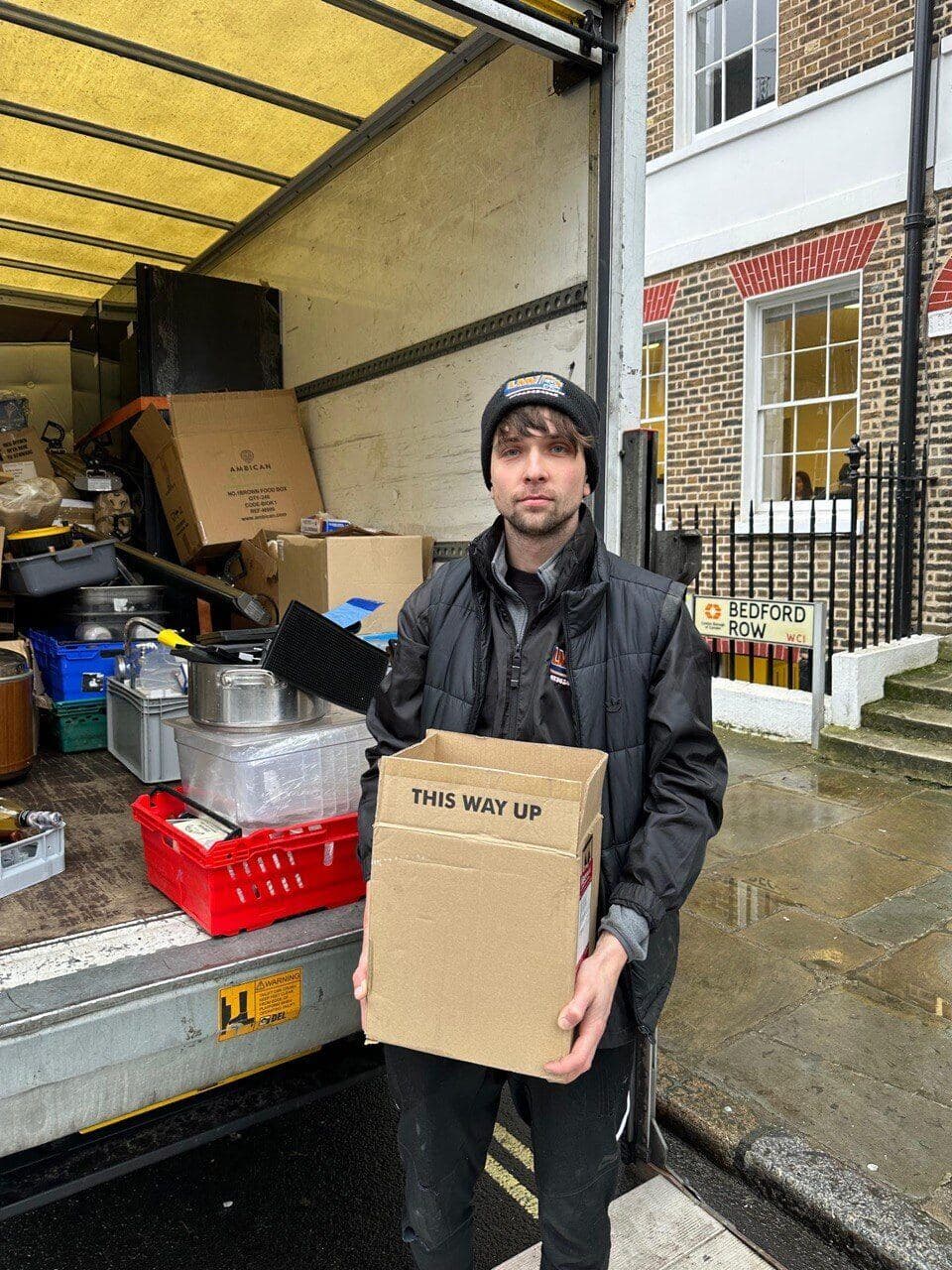 LMV team member carrying a box at Bedford Row, London