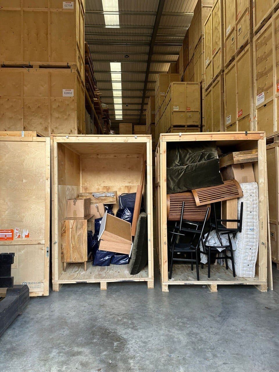 Warehouse storage crates packed with furniture and household items